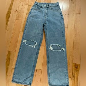 Light wash ripped blue jeans
